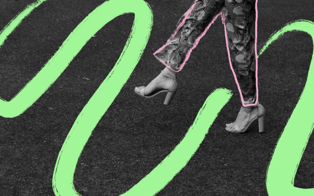 Black and white image of a person walking in heels, overlaid with neon green and pink brushstroke graphics—part of a bold conceptual Speak Your Language brand shoot by Mewphotovideo