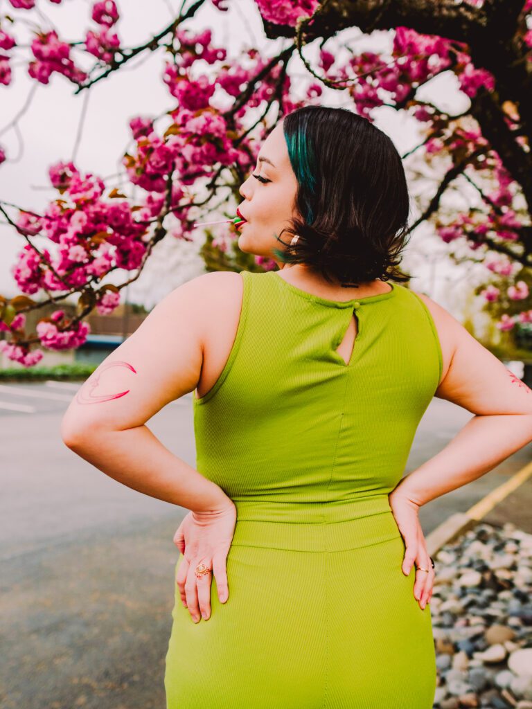 Creative brand photo of Portland artist with cherry blossoms