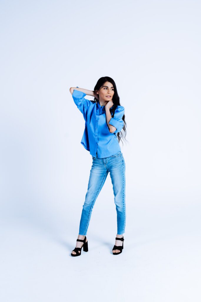Standing pose with stylish movement, ideal for showcasing personality in headshots.