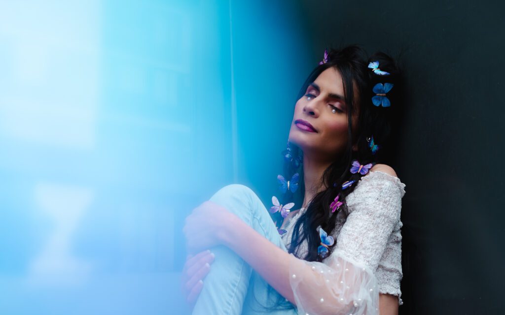 Ethereal branding image with butterflies, soft focus, and layered color effects for a dreamy vibe.