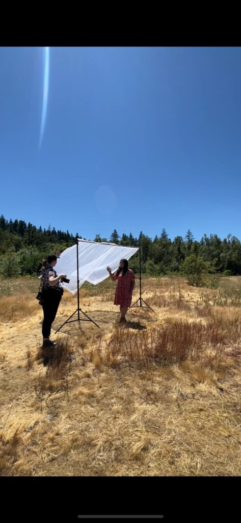 Photographer capturing behind the scenes moments during a lifestyle musician branding session