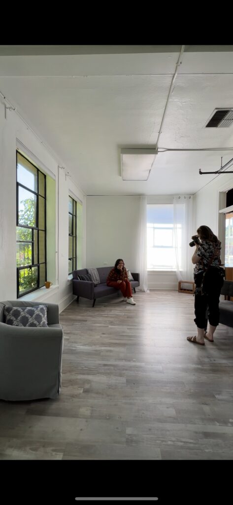 Photographer capturing behind the scenes moments during a lifestyle musician branding session