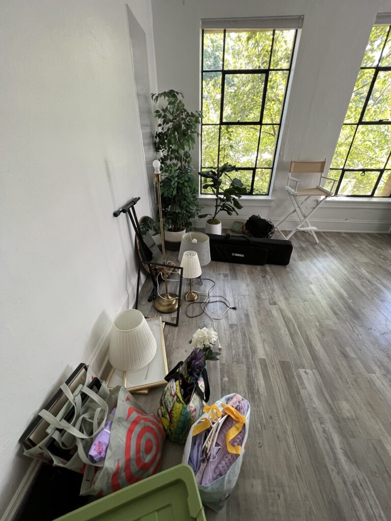Behind the scenes view of lighting and camera setup during a creative branding photoshoot for a musician