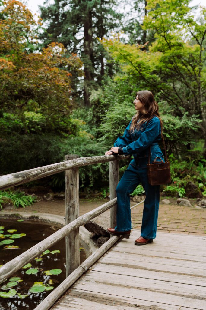 creative professional on wooden bridge during outdoor branding shoot