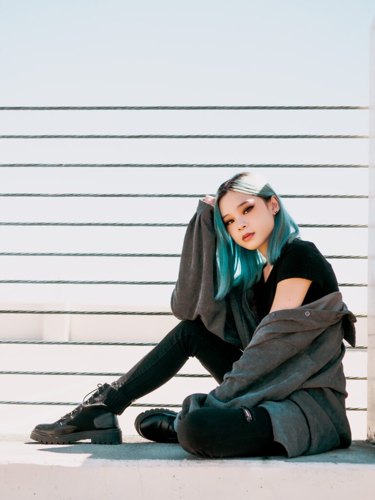 confident woman in athleisure wear posing against rooftop backdrop