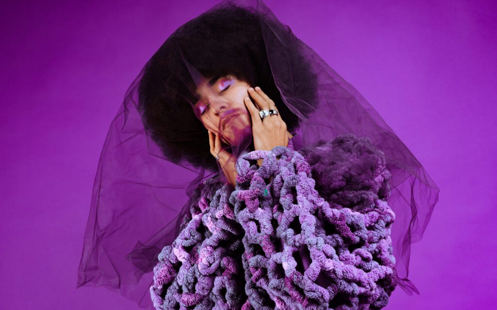Creative portrait of an artist in purple monochrome styling with eyes closed and tulle draped over face, captured during a Studio Lab creative portrait shoot in Portland by Mewphotovideo