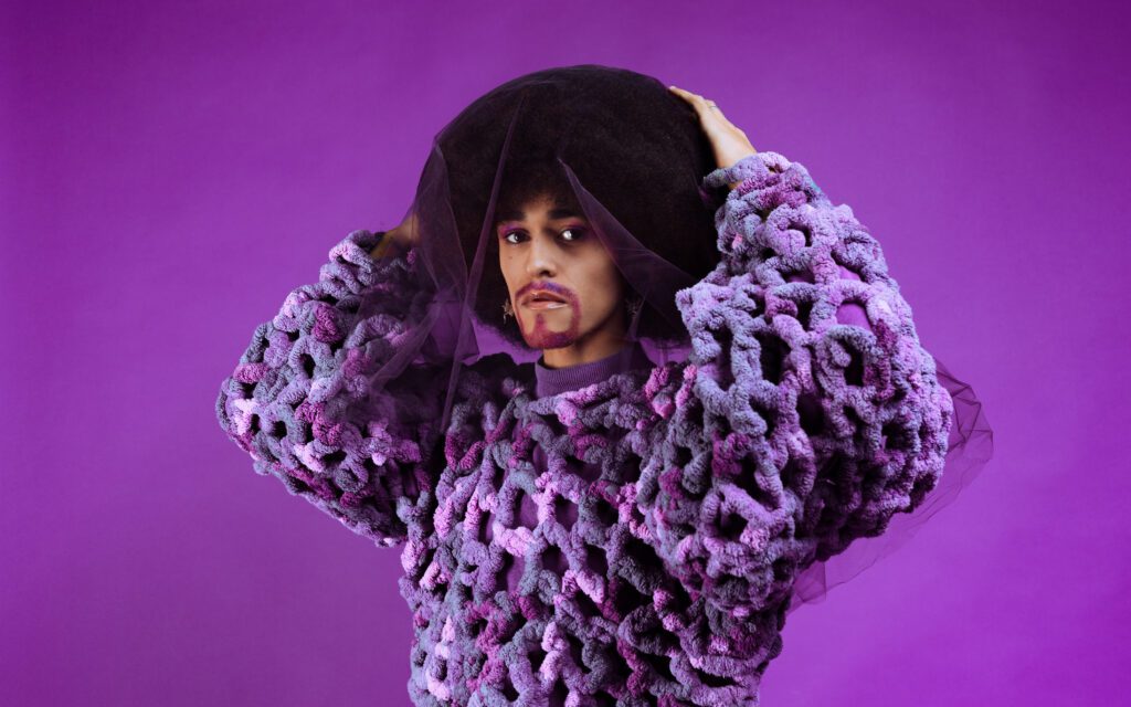 Artistic branding portrait with purple tulle and textured knitwear from a Studio Lab creative session for artists and musicians
