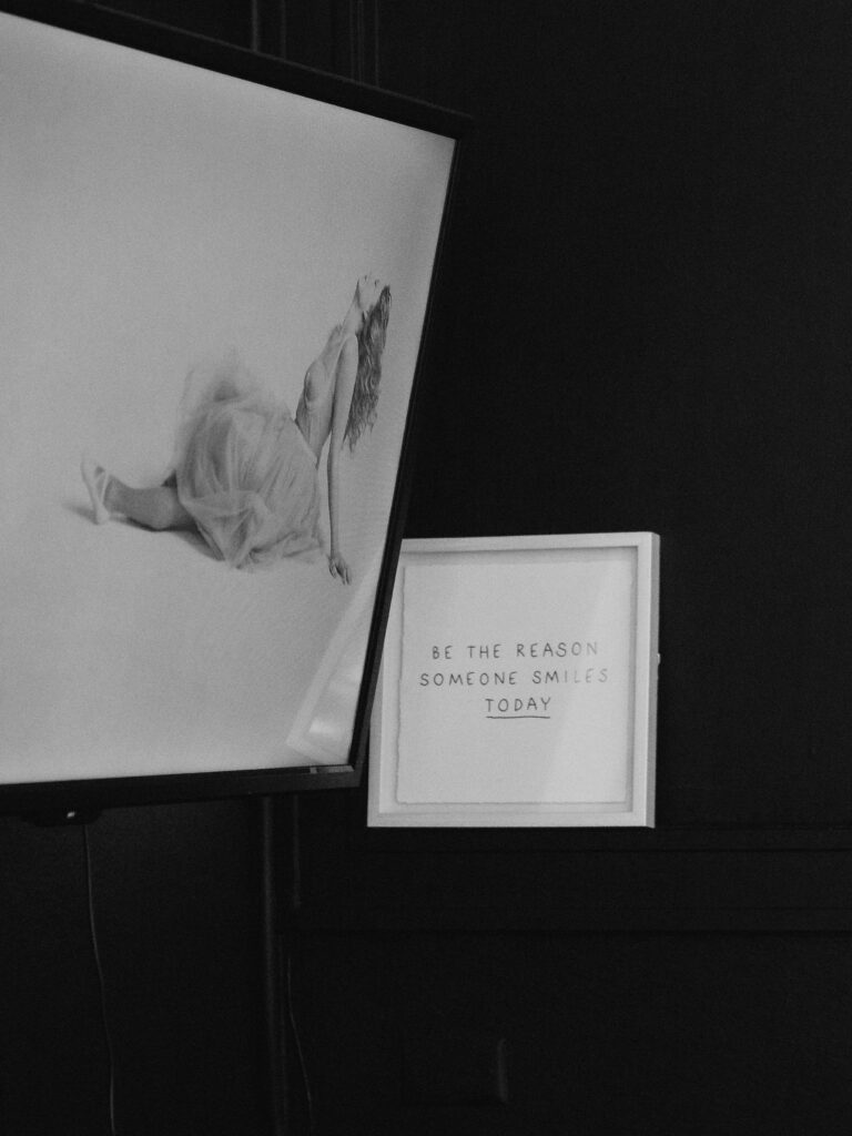 Detail shot of inspirational studio wall decor featuring music artwork during a musician branding session