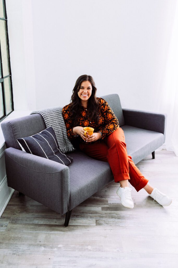 Musician laughing while seated casually during a relaxed studio branding shoot in Portland, Oregon