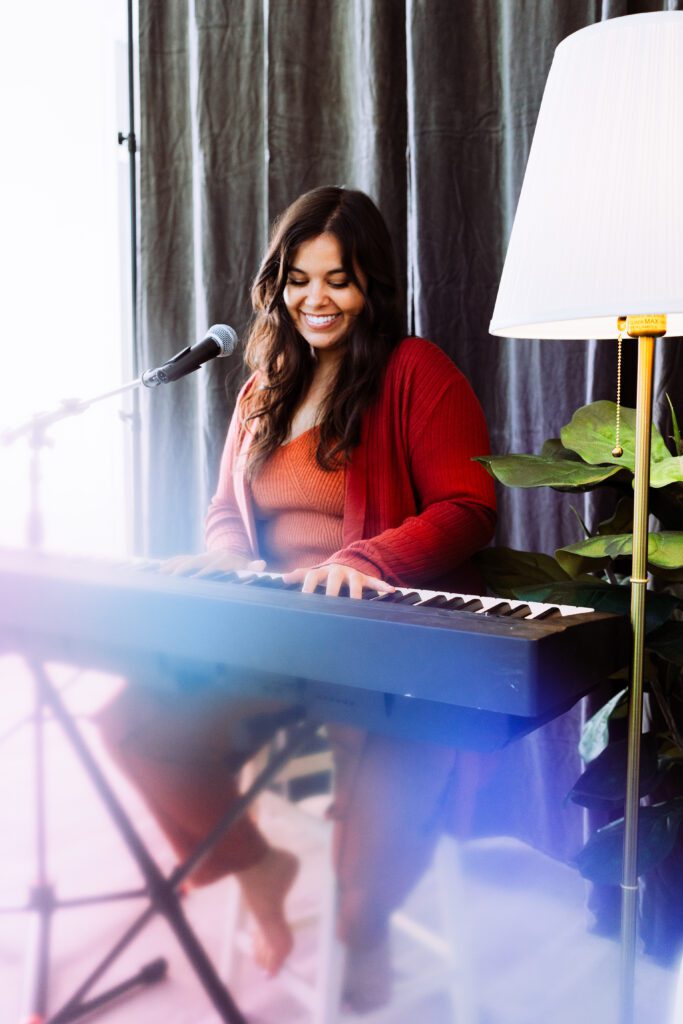 Vibrant portrait of a musician with keyboard and microphone setup during a studio brand shoot in Portland