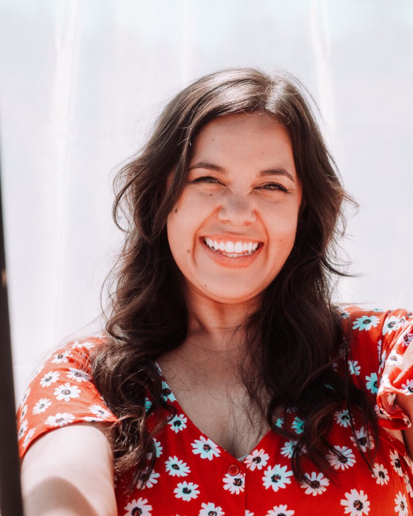 Candid close-up of a musician laughing in natural light during a creative brand shoot near Austin