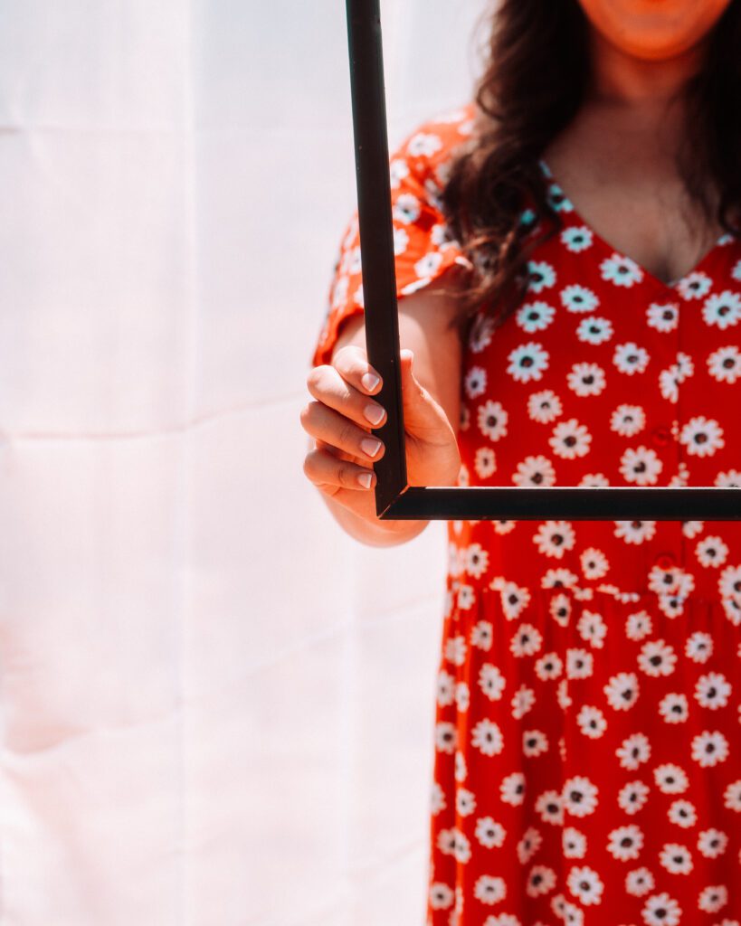 Artistic concept photo of a musician holding a picture frame during a Portland outdoor brand session