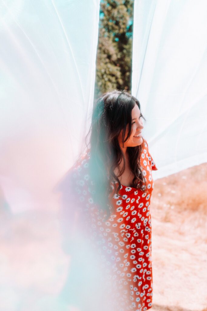 Hazy editorial-style portrait of a musician standing in soft light with creative motion blur effect