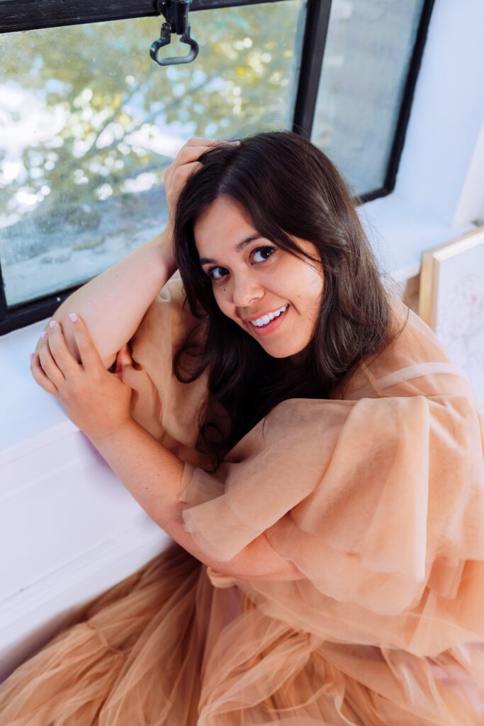 Close-up portrait of a music artist smiling in natural light during a personal brand photography session