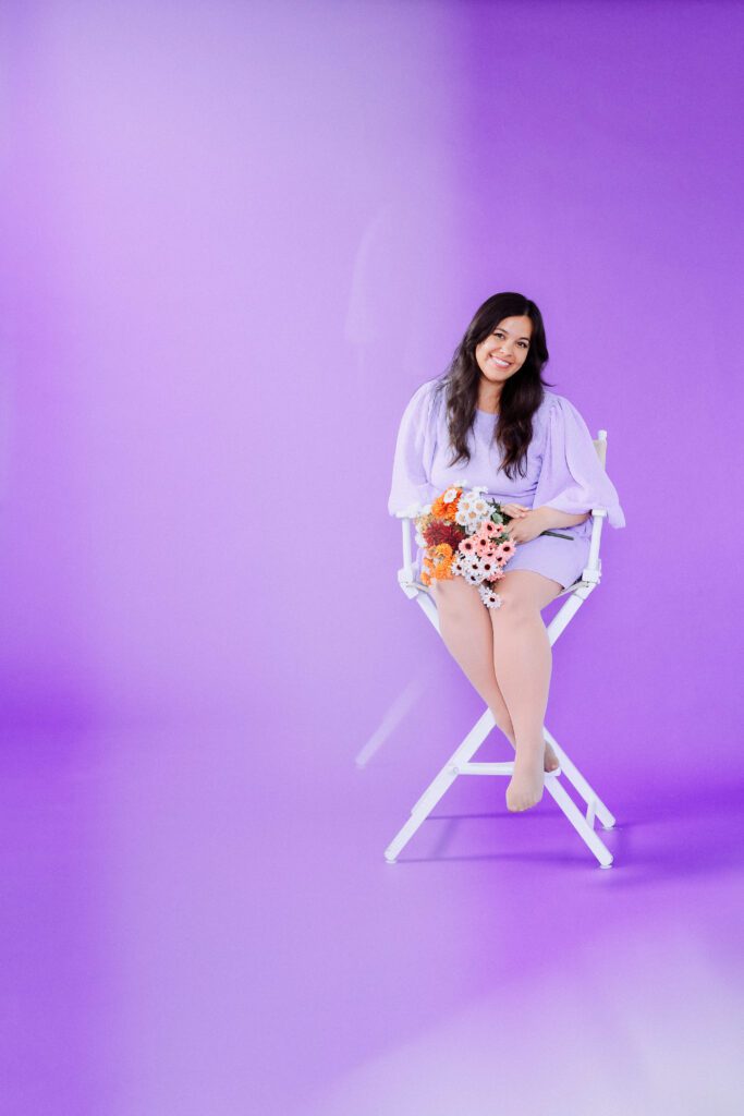 Musician standing solo in front of a purple backdrop during a personal branding session in Portland studio