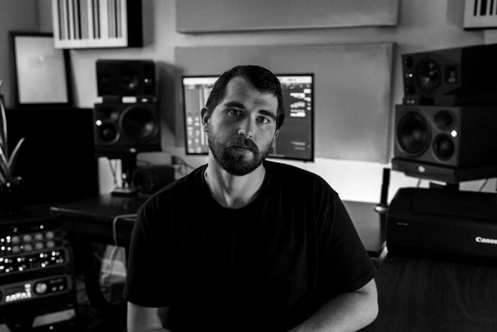 Professional black and white portrait of an independent musician at work
