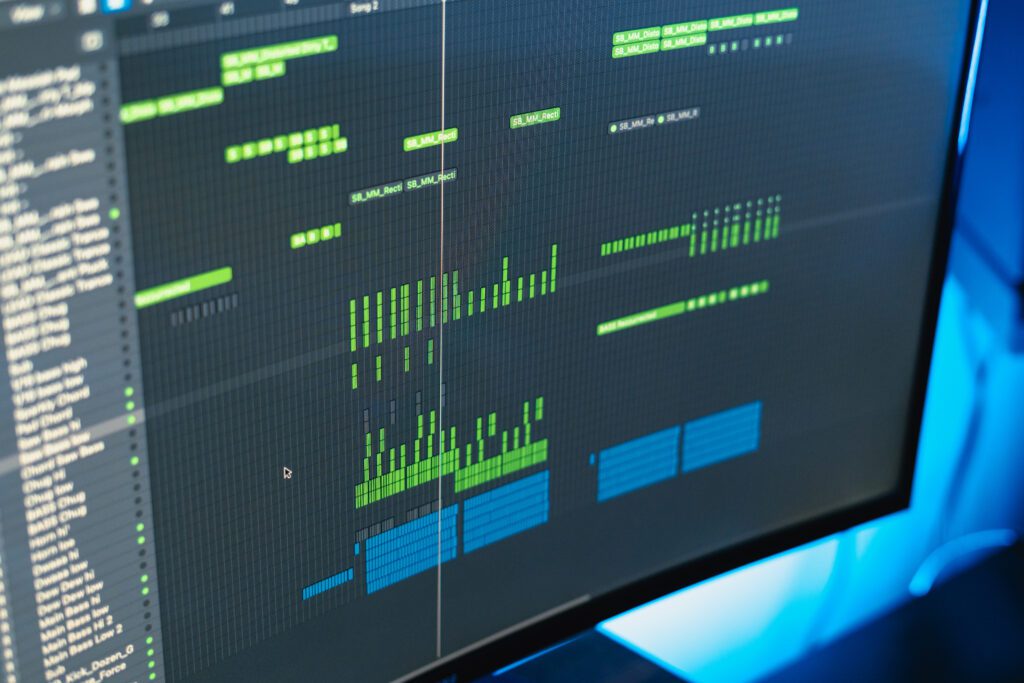 Music project in progress on screen with waveform and synth patterns