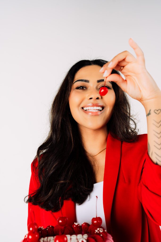 vibrant brand shoot featuring bold red tones and playful expression